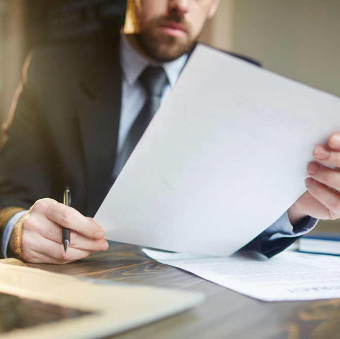 businessman-working-with-documentation-at-desk businessman-working-with-documentation-at-desk