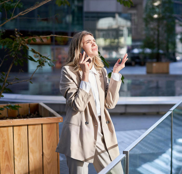frustrated-corporate-woman-standing-on-street-and-having-difficult-phone-call-hear-bad-news-on-tel frustrated-corporate-woman-standing-on-street-and-having-difficult-phone-call-hear-bad-news-on-tel