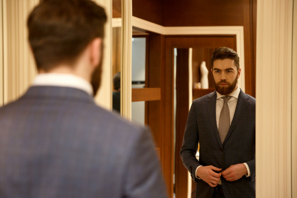 view-from-back-of-man-looking-at-the-mirror