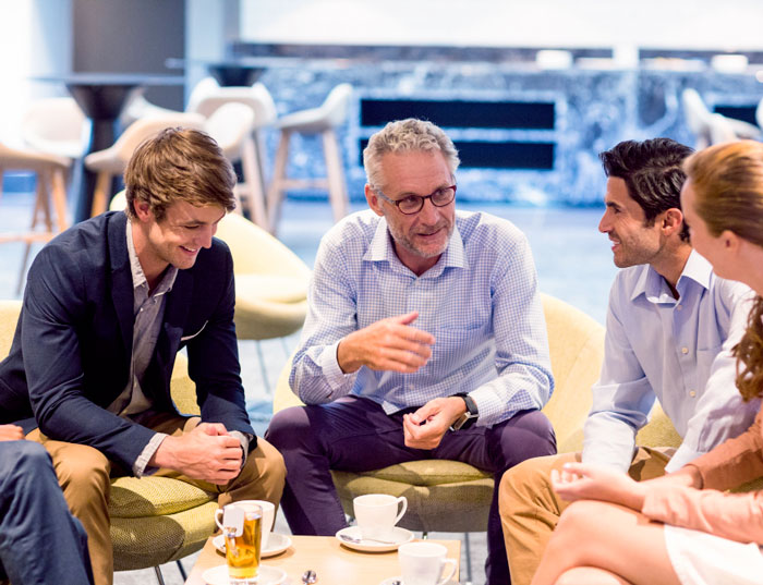 business-people-having-discussion-in-cafeteria